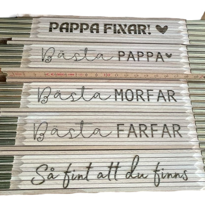 Personligt graverad tumstock